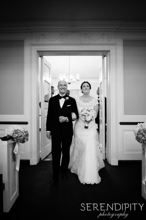 bride walking down the aisle, black and white bridal portrait